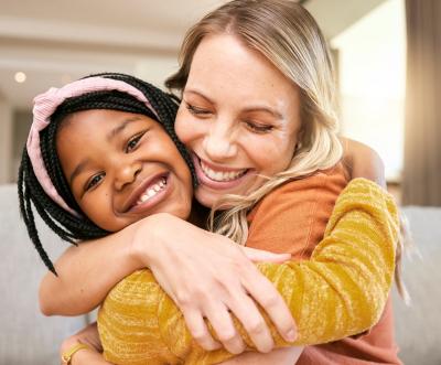 Woman hugging a child
