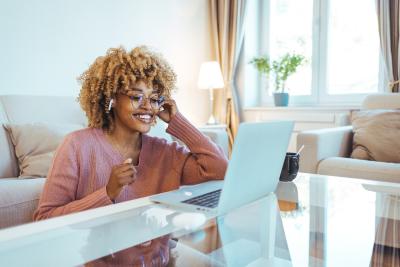 Woman on a phone at a computer