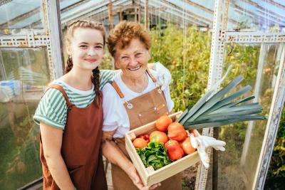 Grandmother and granddaughter in a garden
