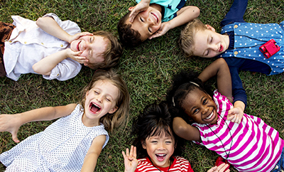 kids laying on their backs in a circle