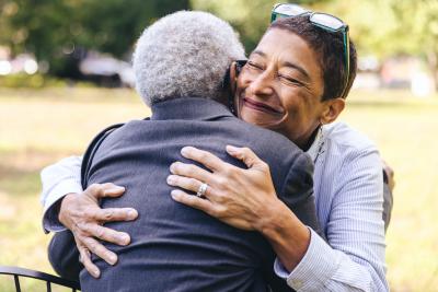 Woman and older woman hugging