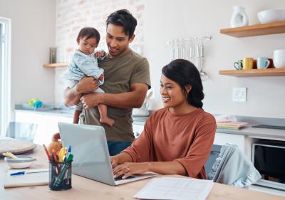 Man holding baby with woman 