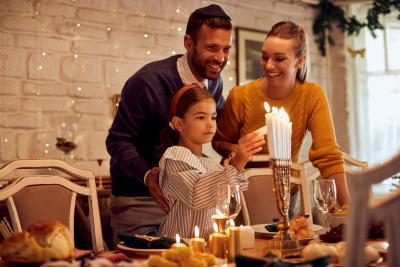 Family lighting candles