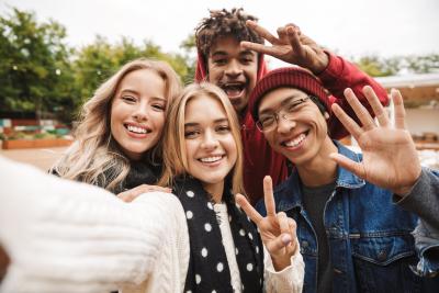 Teens smililing while taking a selfie