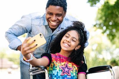 Adult and youth taking a selfie