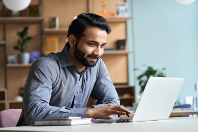 Man looking at laptop screen