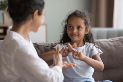 Girl using asl to sign help