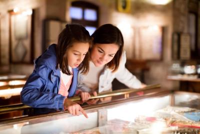 Mothr and daughter pointing at sight during museum visit