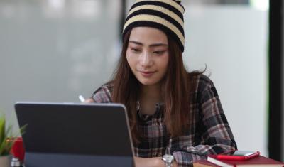 Girl working at laptop computer