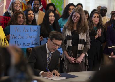 Governor Bob Ferguson signing executive order with DCYF Secretary