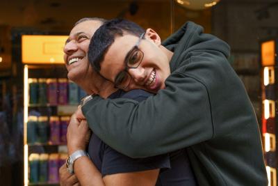 Young man hugging father