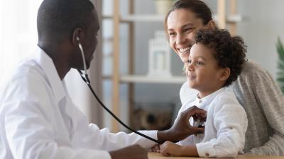 Dr. with stethoscope and child
