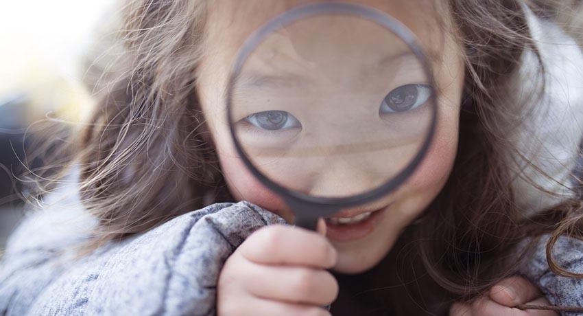 girl with magnifying glass
