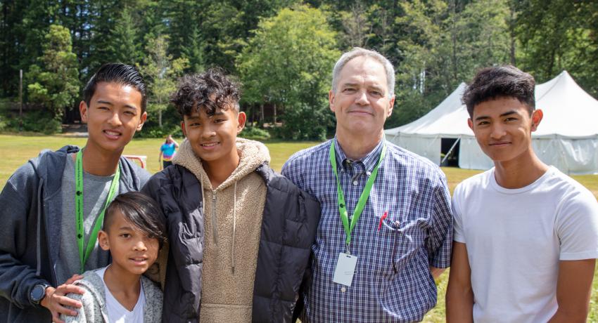 DCYF Secretary Ross Hunter with siblings at Camp To Belong