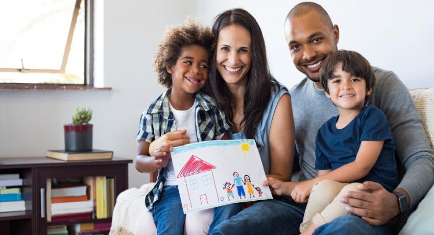 Photo of parents with two young children