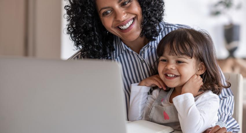 mother and young child on laptop