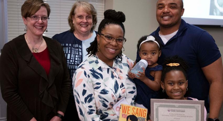 2020 Unsung Hero Recipient Ashley Ewing and her family, with DCYF Deputy Secretary Jody Becker and DCYF Director of Family Support Programs Judy King
