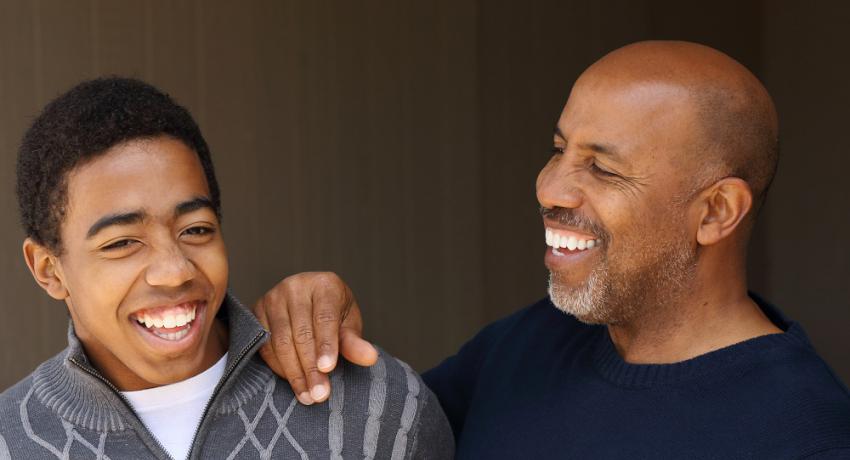 Young man and mentor laughing together