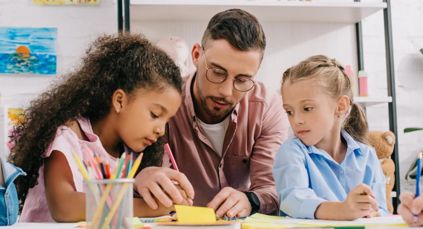 teacher with two young children