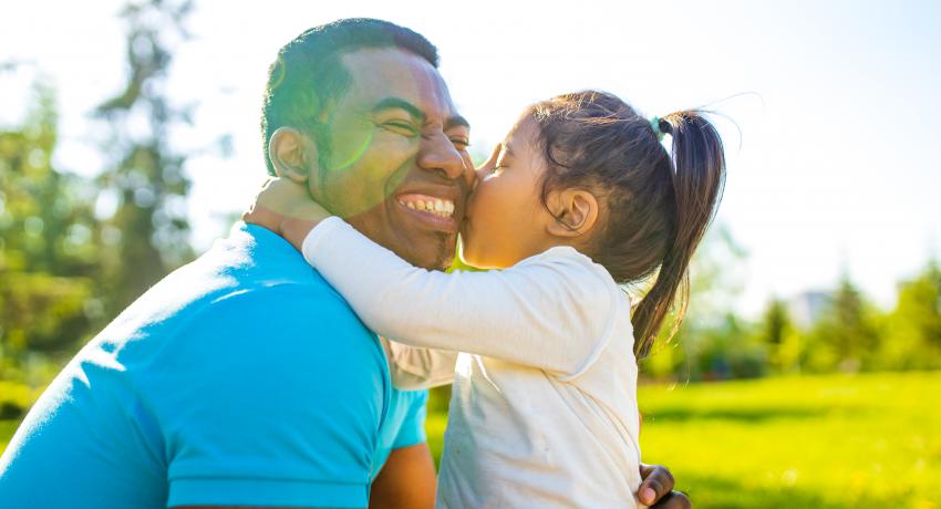 father and child hugging