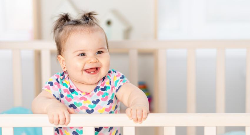 Female infant in crib. 