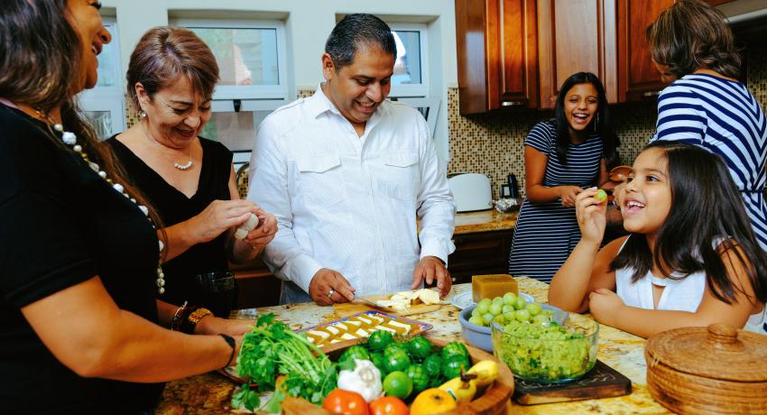 Family in kitchen preparing food