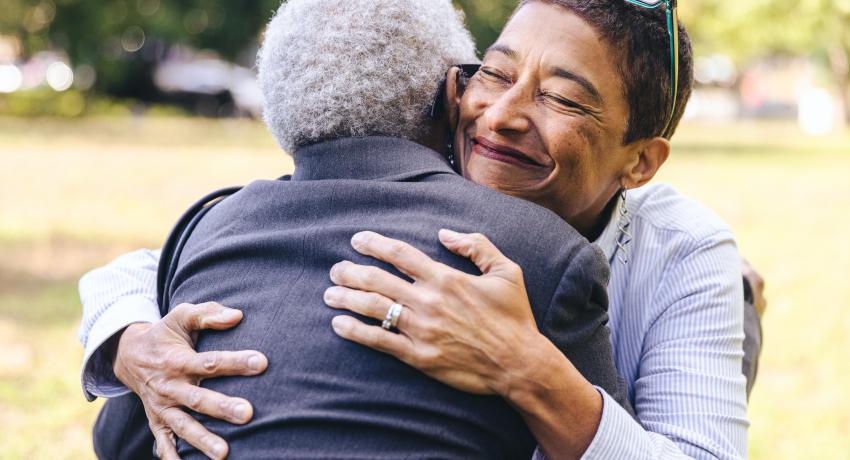 Woman and older woman hugging