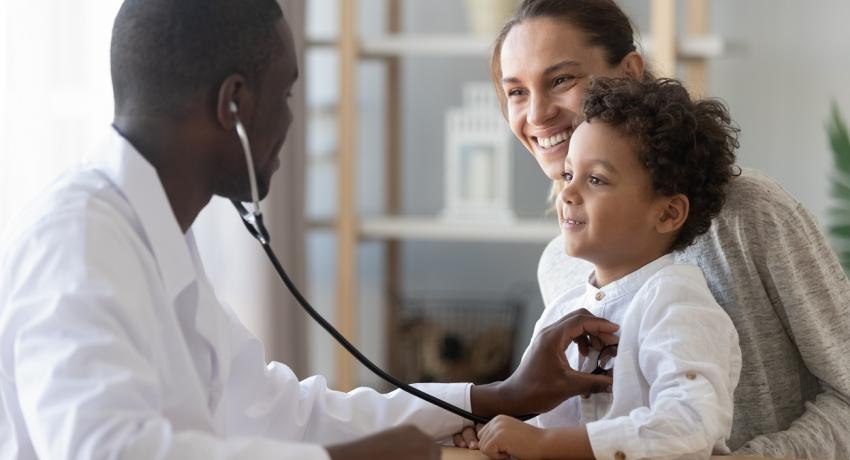 Dr. with stethoscope and child